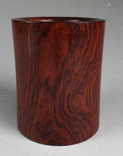 A CARVED WOODEN BRUSHPOT