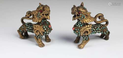 A PAIR OF BRONZE QILIN FIGURINES