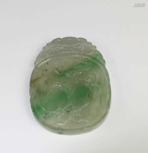 A CARVED JADE PENDANT