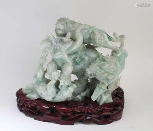 A CHINESE CARVED JADE FIGURINE