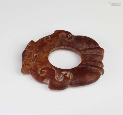 A CARVED JADE ORNAMENT