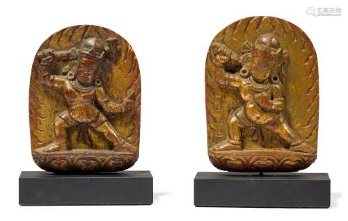 TWO SMALL WOOD RELIEFS.Tibet, 14th century. H 8.5 cm.Wood wi...