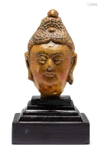 A POLYCHROME STUCCO HEAD OF BUDDHA.China, Ming dynasty, heig...