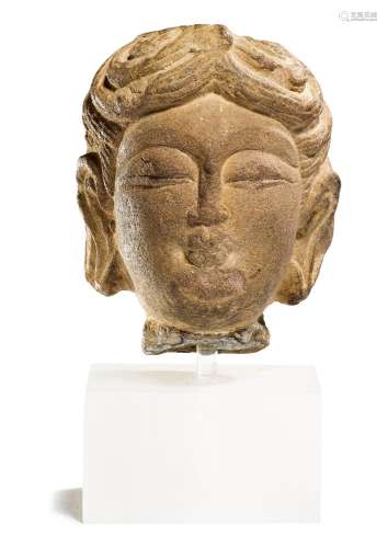 A SMALL SANDSTONE HEAD OF AN ATTENDANT.China, Tang dynasty, ...