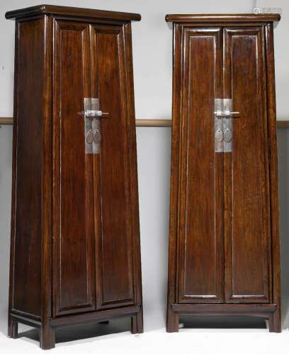 A PAIR OF HIGH CABINETS.China, 20th c. Height 224 cm.Dark st...