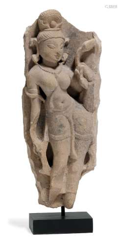 A BEIGE SANDSTONE FIGURE OF A YAKSHI.Central India, 12th/13t...