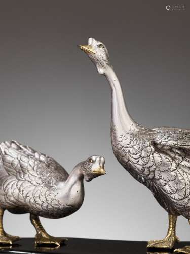 CHIKAYOSHI: A GILT AND SILVERED BRONZE OKIMONO OF TWO GEESE