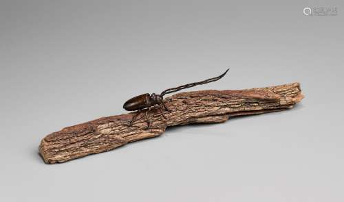 AN ARTICULATED BRONZE OKIMONO OF A SAWYER BEETLE CLIMBING A ...