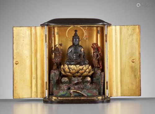 A LARGE BLACK AND GOLD LACQUERED SHRINE (ZUSHI) WITH KANNON,...