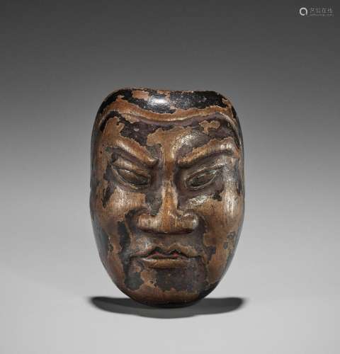A LARGE AND VERY RARE PAINTED HINOKI WOOD MASK NETSUKE OF A ...