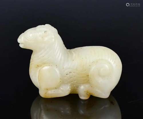 A Carved White Jade Recumbent Sheep Ming or Before