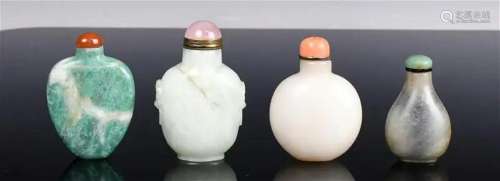 A Group of Four Carved Snuff Bottles Late Qing