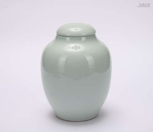 A celadon-glazed jar and cover