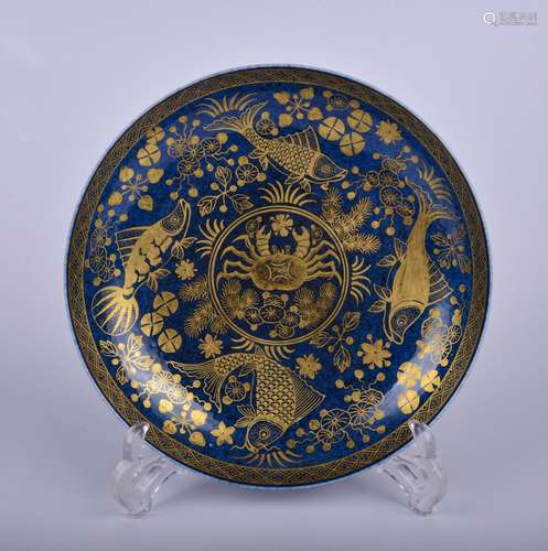 A blue glazed 'fish and waterseeds' dish painting in gold