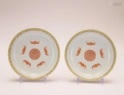 A famille-rose allite red glazed 'floral and bats' dish