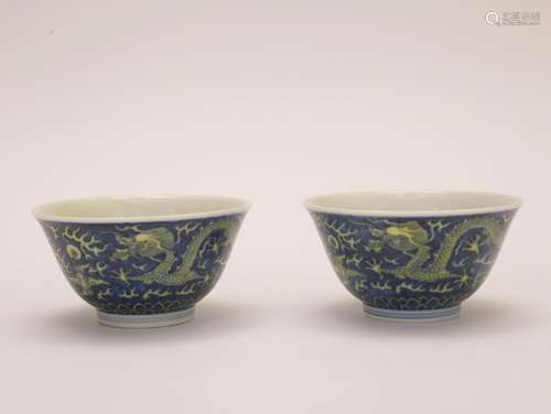 A pair of blue-ground yellow glazed 'dragon' bowl