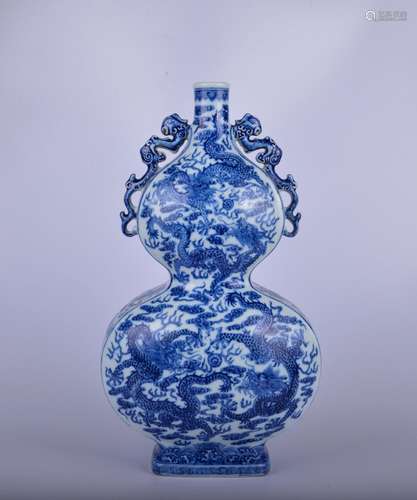 A blue and white 'two dragons playing with a pearl' gourd-sh...