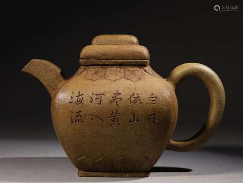 A redware 'lotus petals and poems' teapot