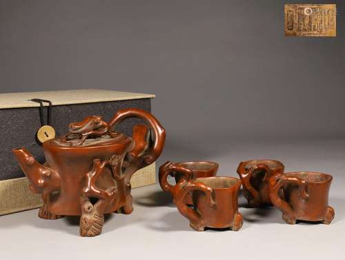 A set of redware stump-shaped 'plum blossom' tea set