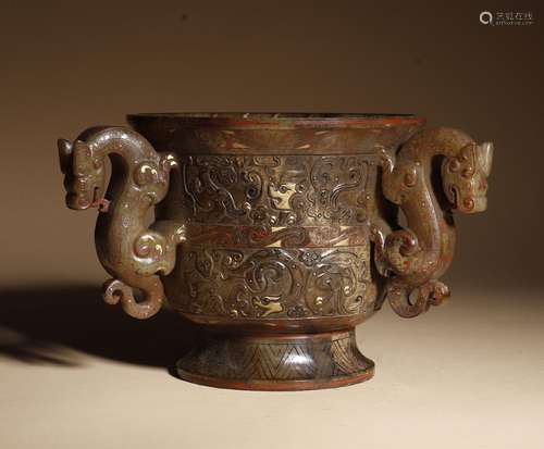 A jade 'dragon' cup with three dragon's head shaped ears