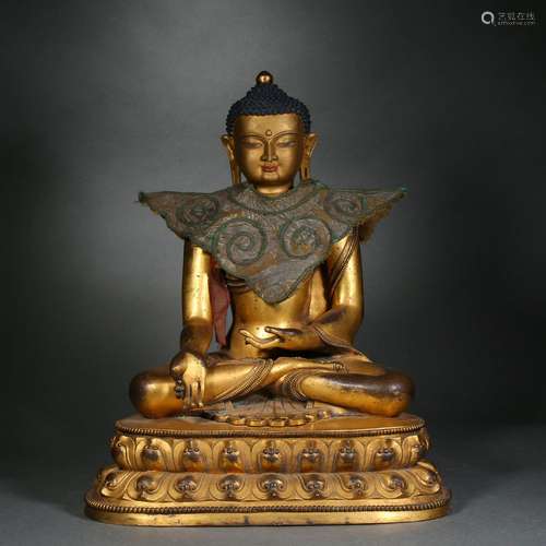 A gilt-bronze statue of Pharmacist Buddha