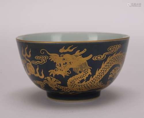 A black-ground 'dragon' bowl painting in gold