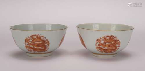 A pair of allite red glazed 'dragon' bowl