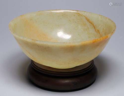 A jade permeated red and solid colored bowl