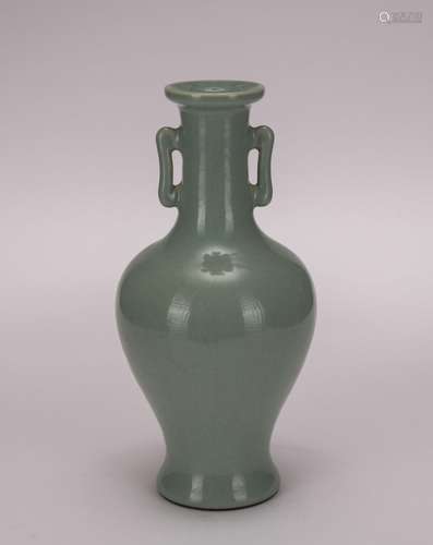 A celadon-glazed and officer glazed vase