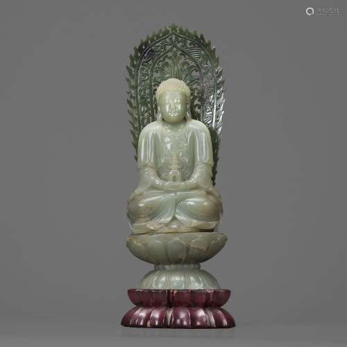 STATUETTEen jade céladon, représentant le Bouddha assis en m...