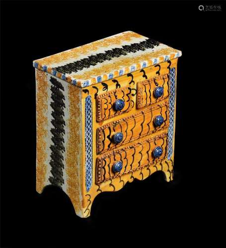 A PEARLWARE SPONGE-DECORATED MODEL OF A CHEST OF DRAWERS, PO...