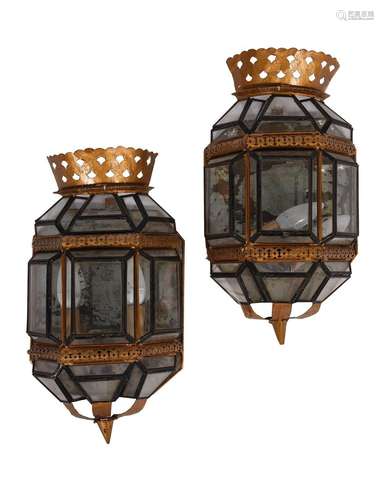 A PAIR OF CONTINENTAL EBONISED AND GILDED TOLE WALL LANTERN ...