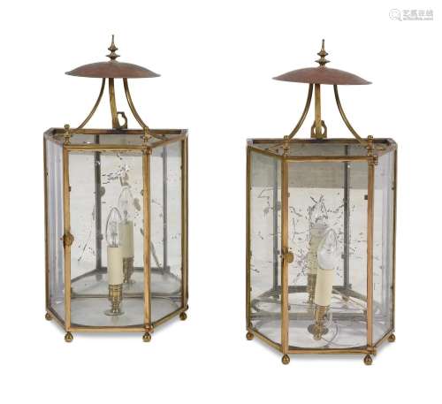 A PAIR OF GLAZED, BRASS FRAMED AND MIRROR BACKED WALL LANTER...