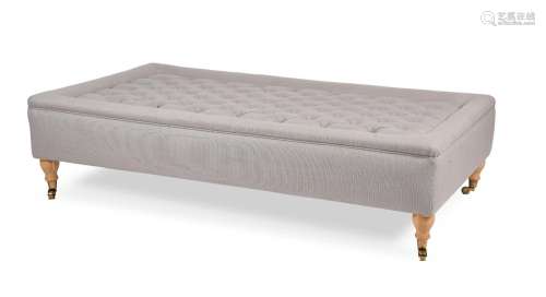 AN UPHOLSTERED OTTOMAN, OF RECENT MANUFACTURE
