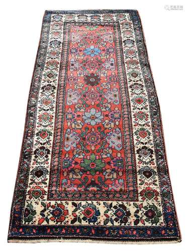 A NORTH WEST PERSIAN RUG, approximately 215 x 93cm