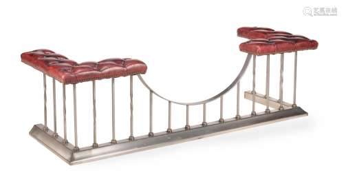 A STEEL AND RED LEATHER UPHOLSTERED CLUB FENDER, 20TH CENTUR...