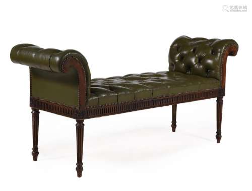 AN EDWARDIAN MAHOGANY AND BUTTONED GREEN LEATHER UPHOLSTERED...
