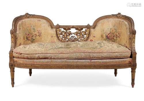 A FRENCH CARVED GILTWOOD AND TAPESTRY UPHOLSTERED SETTEE, TH...