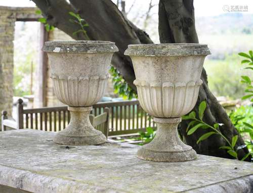 A PAIR OF COMPOSITION STONE VASES, IN 19TH CENTURY STYLE, MI...