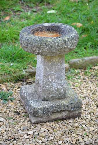 A CARVED LIMESTONE BIRD BATH, EARLY 20TH CENTURY