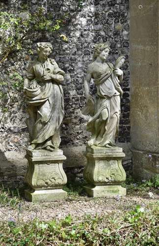 A PAIR OF RECONSTITUTED STONE FEMALE FIGURES EMBLEMATIC OF T...