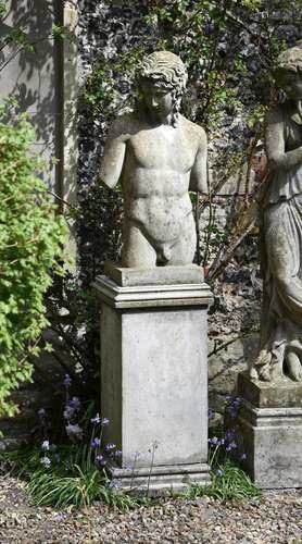 AFTER THE ANTIQUE- A RECONSTITUTED STONE FIGURE, EROS TORSO ...