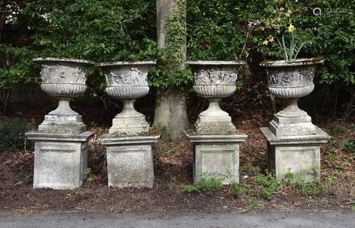 A SET OF FOUR LARGE STONE GARDEN URNS ON PEDESTAL STANDS, 20...