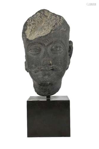 A large Gandhara grey schist head of a Bodhisattva