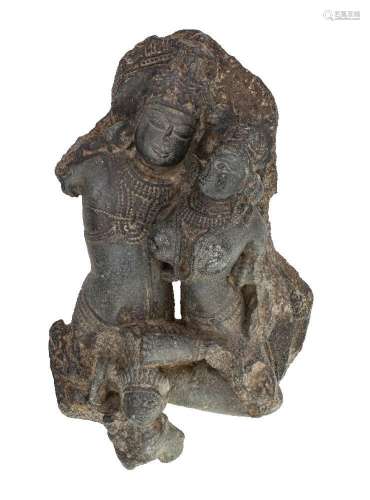 A black stone fragment of Uma-Mahesvara