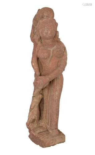 A red sandstone figure of an attendant