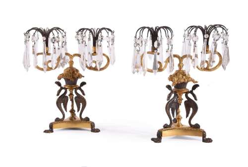 A PAIR OF REGENCY GILT AND PATINATED BRONZE TWIN-LIGHT TABLE...