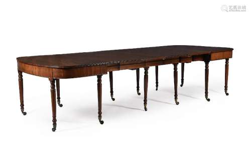 A LATE GEORGE III MAHOGANY TELESCOPIC EXTENDING DINING TABLE...