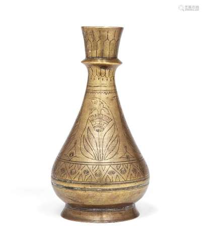 An engraved brass vase