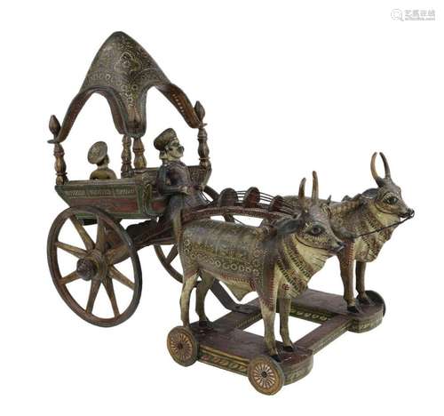 A polychrome lacquered painted wooden carriage drawn by oxen